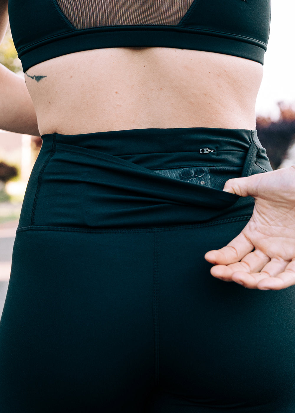Essential Bird 7/8 length Running Tights in Black, back pocket