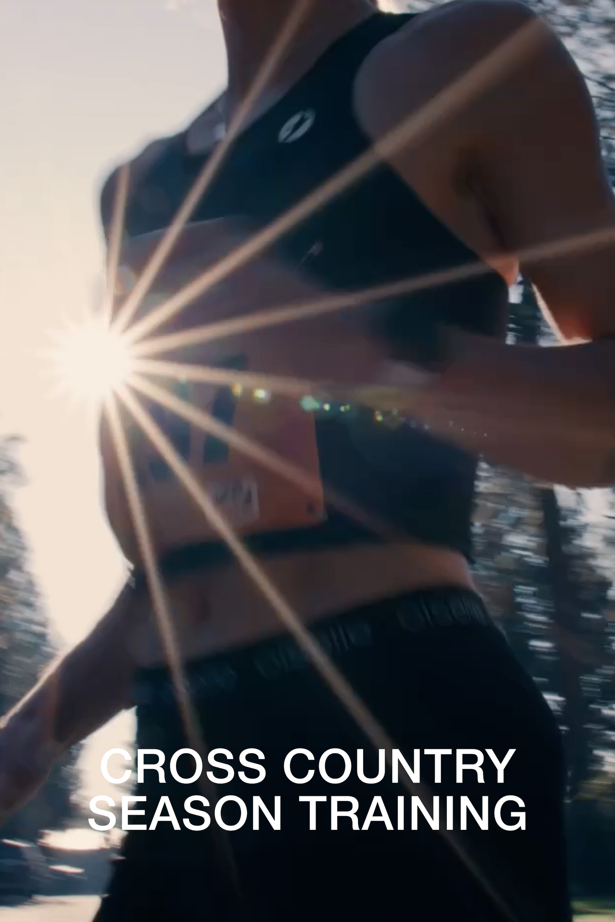 A close-up action shot of a cross country runner wearing a black sports bra and black shorts with the text 'CROSS COUNTRY SEASON TRAINING' overlaid at the bottom. The sun is bright and low in the frame, creating a strong lens flare.