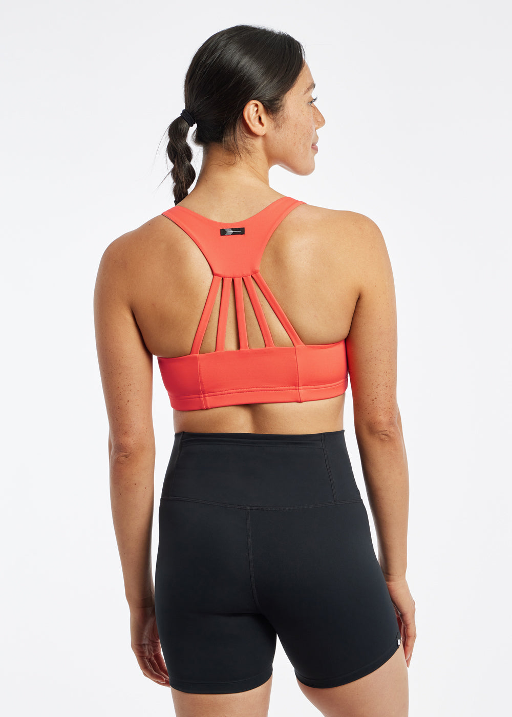 Open Lane Strappy Sports Bra in orange alpenglow, back view