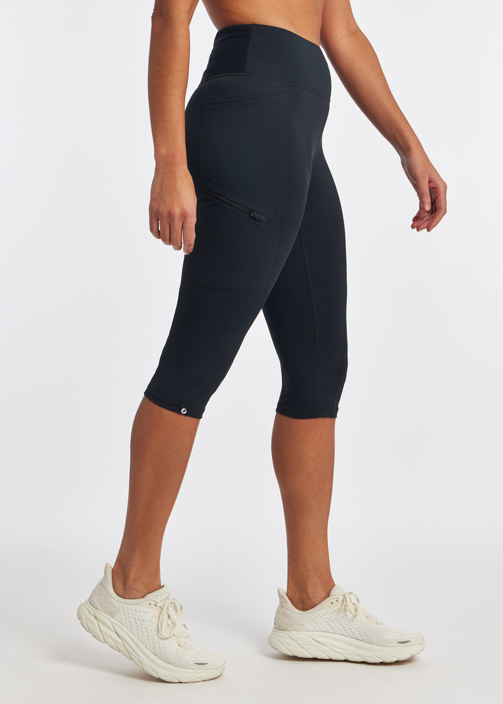 Woman wearing black running knickers in size 4, side view