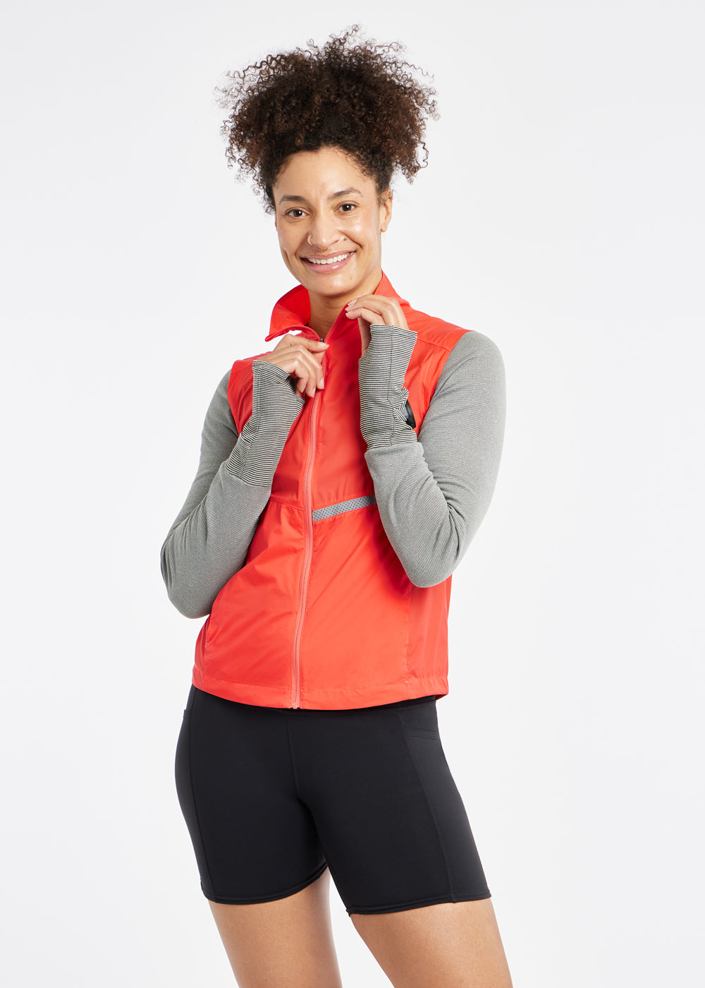 Vigor Packable Running Vest in Alpenglow Orange, front