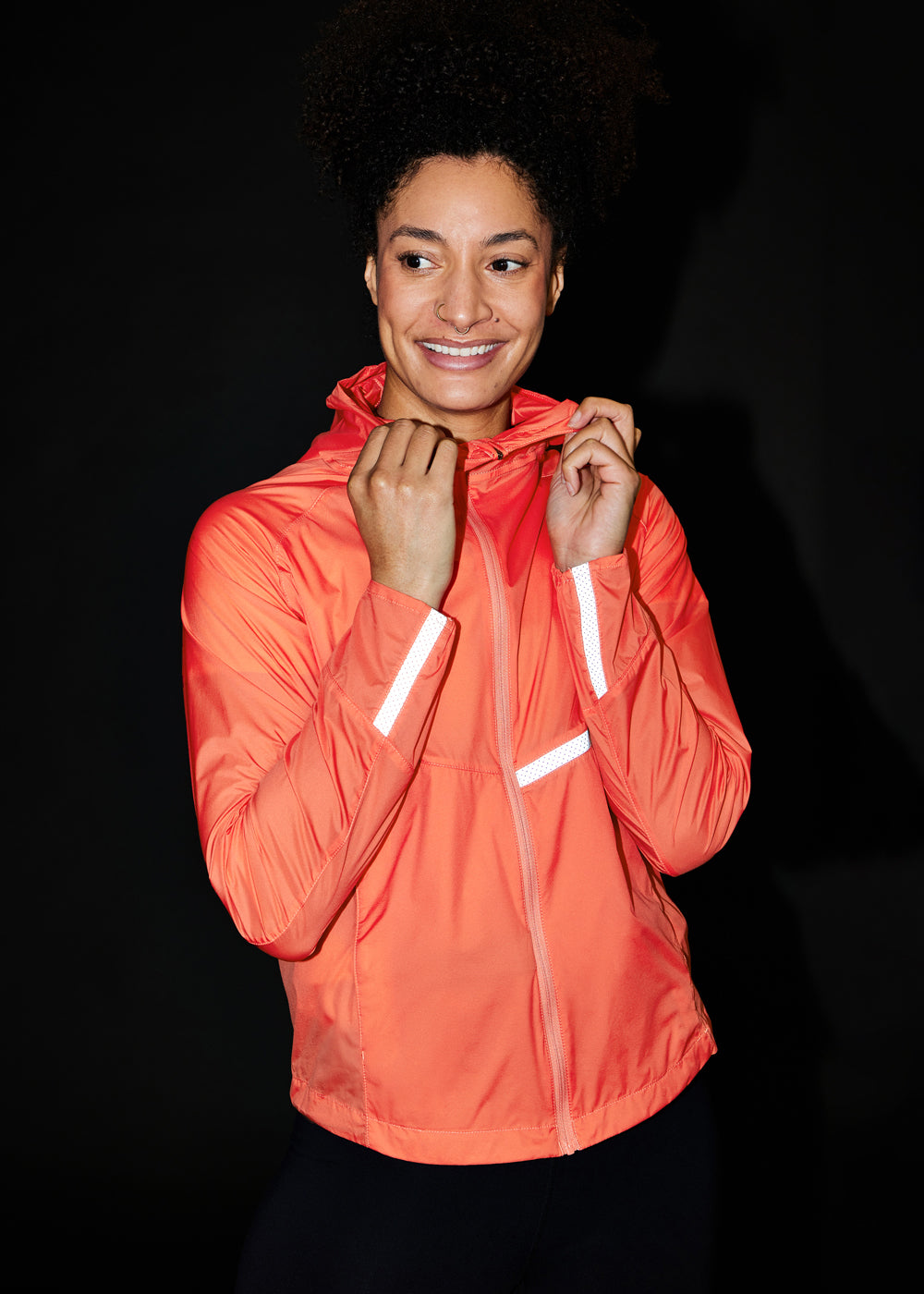 Vim Packable Running Jacket in Alpenglow, front view with reflective details